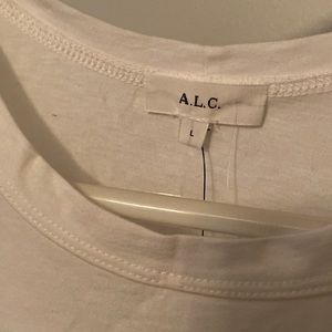 Got two of the same shirt and ended up keeping the Medium. Never worn, NWT.